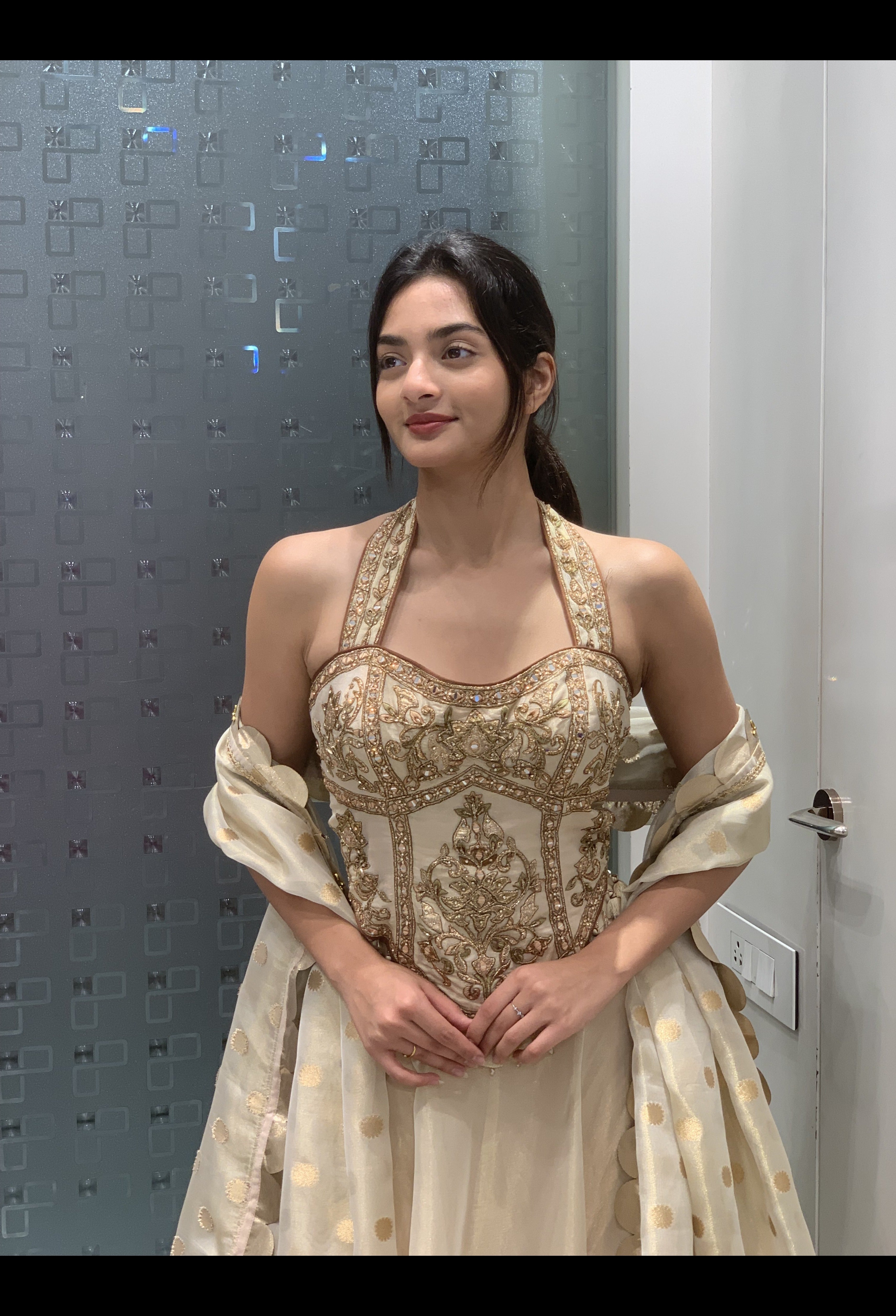 Cream Tissue Golden Patch Work Halter Neck Top & Lehenga