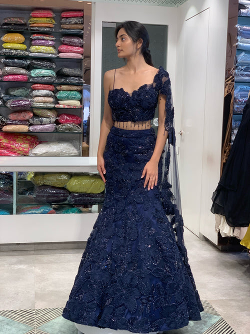 Blue Net Applique & Cutwork One Shoulder Falling Sleeve Top & Fish Cut Lehenga